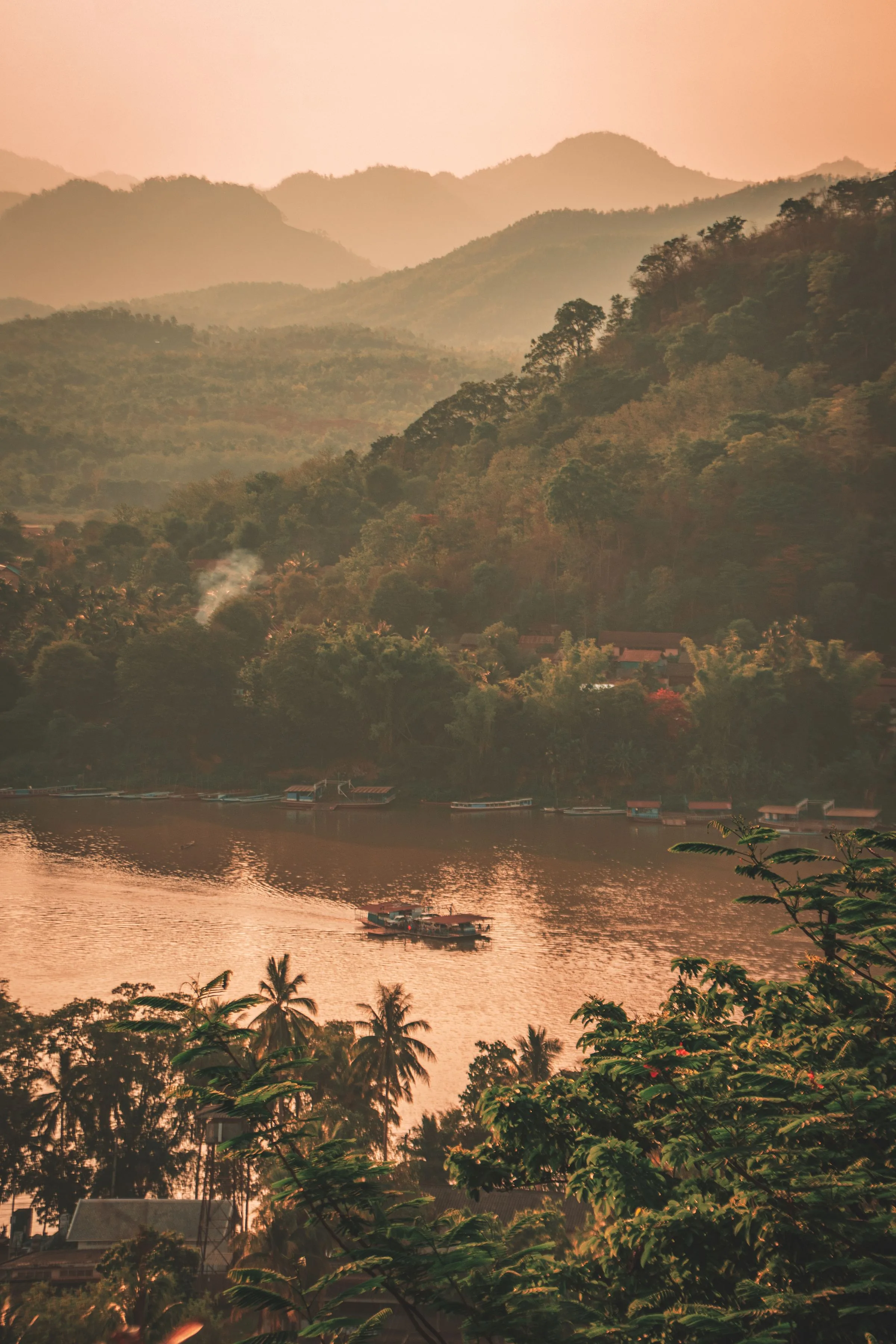 The Mekong River and forested hills at dusk near Luang Prabang, Laos