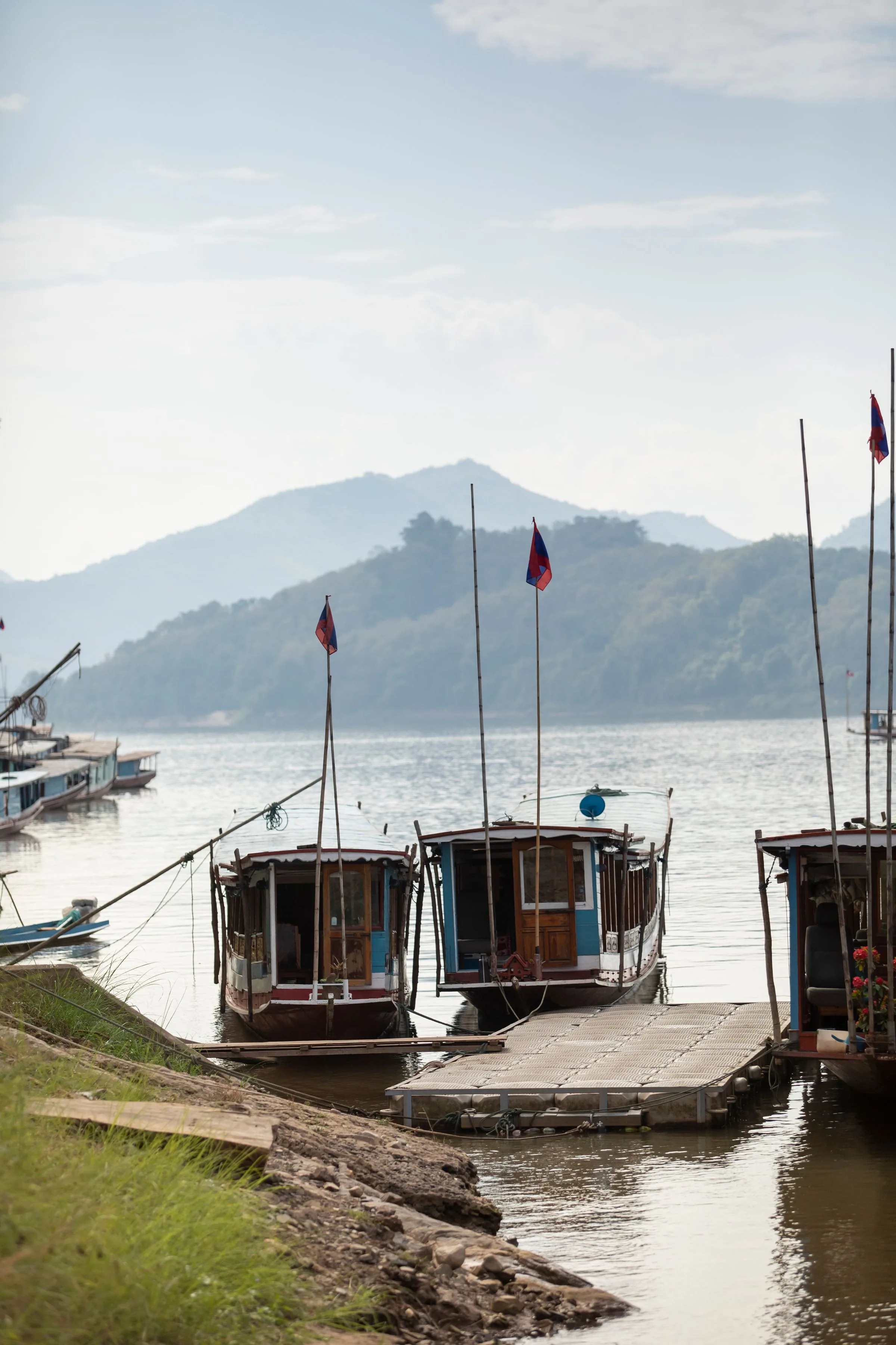 Traditional wooden boats moored on the Mekong River at Luang Prabang